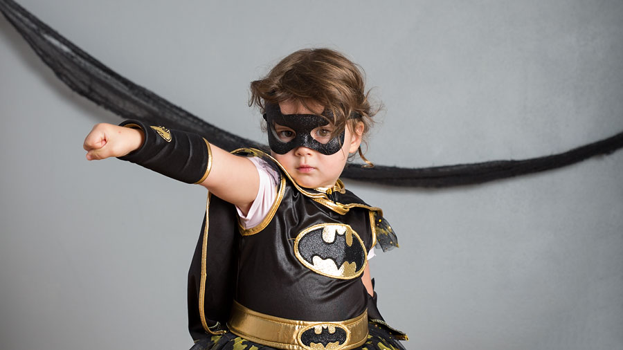 little girl dressed up at batman